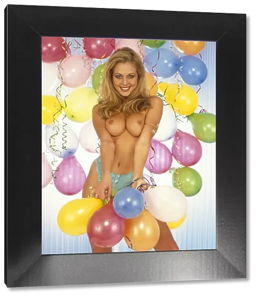 Katie Richmond, topless, surrounded by balloons
