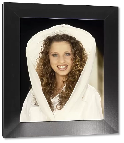 Jordan  /  Katie Price wearing a white hooded top
