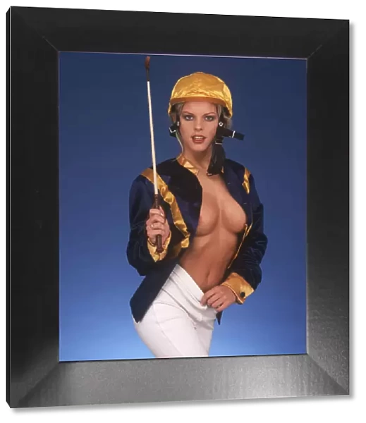 Danni Wheeler, topless, in a jockey outfit
