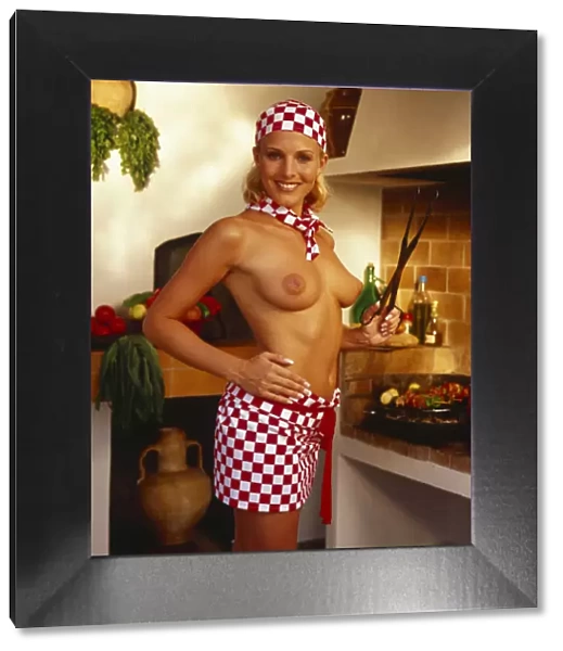 Jo Hicks, topless, dressed as a cook