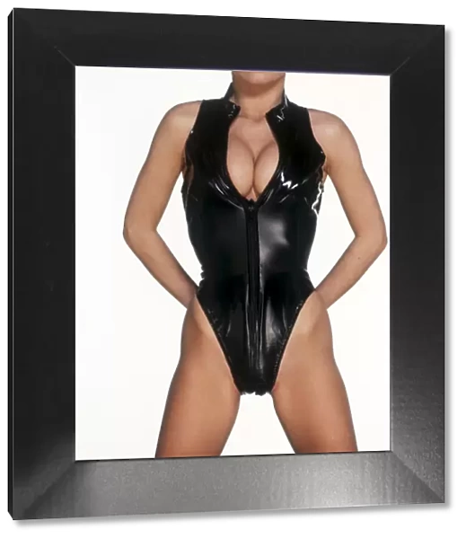 Female body with a sexy black PVC outfit