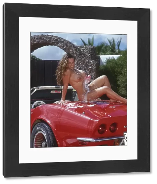 Andrea - Nude girl outdoors washing a corvette