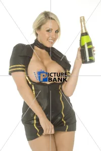 Breasts Gallery: Danii Harwood topless indoors holding a bottle of champagne