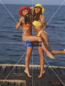 Two girls having fun by the beach