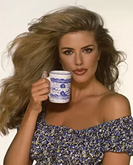 Clean Gallery: Kirsten Imrie holding a white / blue mug